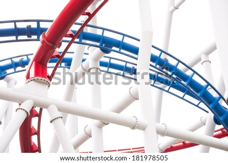 a segment of red and blue twisted roller coaster rail,isolated