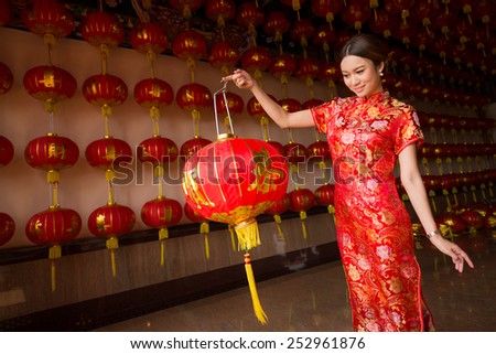 girl in qipao holding lantern