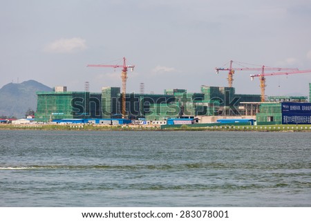 BOAO - CHINA, MAY 11 : Construction crane building new tower in Boao forum for asia theme park in Hainan, China,May 11 2015