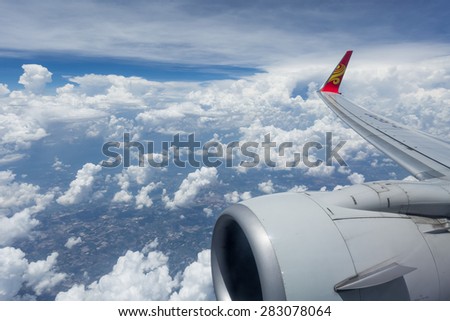 BANGKOK - THAILAND, MAY 10 : Hainan Airlines logo winglets flying over clouds , Bangkok Thailand on May 10, 2015
