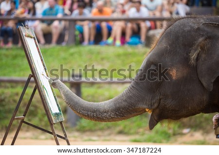 CHIANG MAI, THAILAND - October 28, 2015: Trained elephant painting show at Mae Sa elephant camp, Chiang Mai Thailand on October 28,2015
