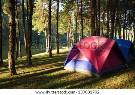 Camping site at lake side at sunrise.