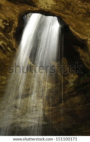 Waterfall flows into holes at Sang Chan Waterfall.