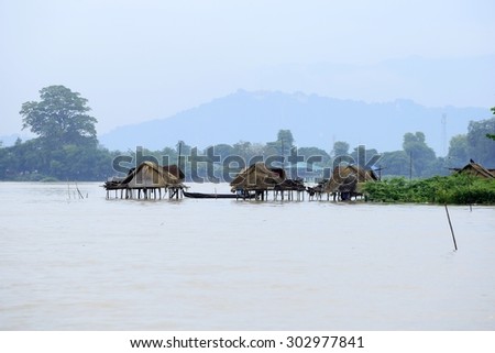 Peaceful scenes of rural people live in huts built on the water.