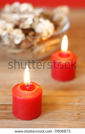 Burning candles and dried plants