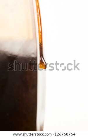 Honey flows from a jar