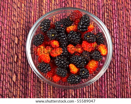Wild berries in a small clear dish