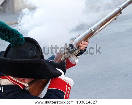 historic soldier shooting with an vintage gin, muzzle-loader, front loader