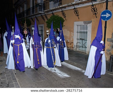ALGECIRIAS, SPAIN - APRIL 8: Bearers at Holy Thursday night Procession in Algeciras,  April 8, 2009. The conical hoods evokes an approach of the bearer to the sky, interpreted like salvation place.