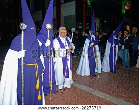 ALGECIRIAS, SPAIN - APRIL 8: Bearers at Holy Thursday night Procession in Algeciras,  April 8, 2009. The conical hoods evokes an approach of the bearer to the sky, interpreted like salvation place.