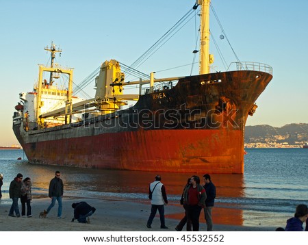 ALGECIRAS, SPAIN - JANUARY 29: Cargo ship got stuck on the beach of Algeciras, in Algeciras, Andalusia, Spain, January 29, 2010. Ship accidents happen often when the weather is stormy.