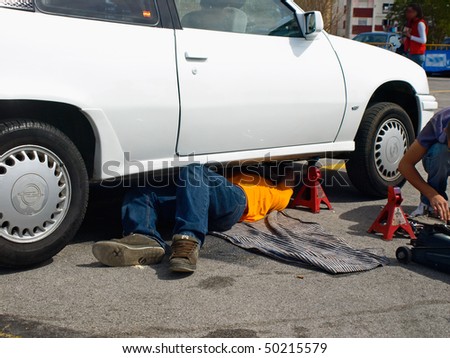 Man Repairing Car