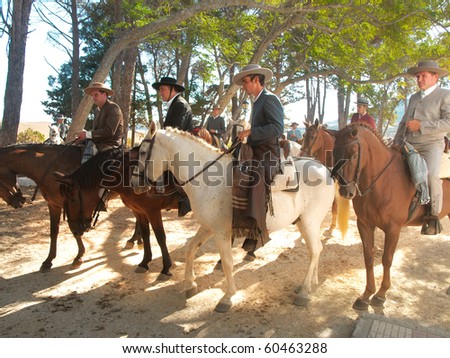 TARIFA, SPAIN - SEPTEMBER 05: Fair of Tarifa with a horse rider procession on September 05, 2010 in Tarifa. About 500 riders participate in the procession, bringing the Virgin de la Luz to the town