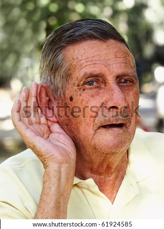 Old man hard of hearing, outdoor