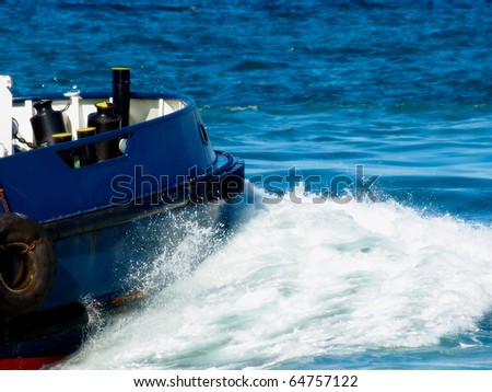 ship moving in the sea splashing water breaking the waves
