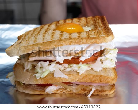 giant sandwich with egg chicken and bacon