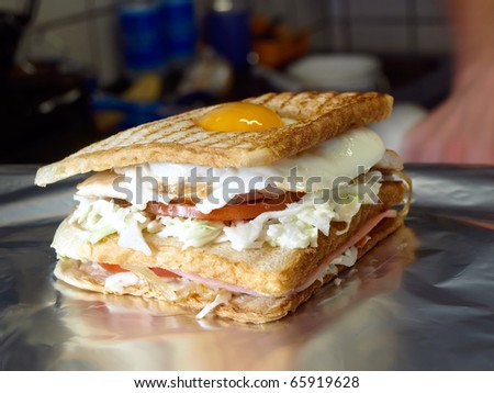 Giant sandwich with chicken bacon and egg