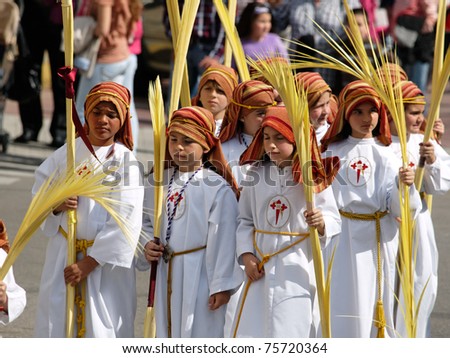 ALGECIRIAS, SPAIN - April 17: unidentified children participate in Palm Sunday Procession on March 17, 2011 in Algeciras, Spain. The  palm leaves represent the arrival of Jesus Christ on Palm sunday in jerusalem