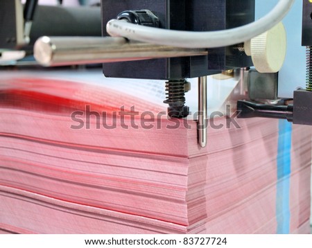 paper pile in a finishing, folder station in an offset printer