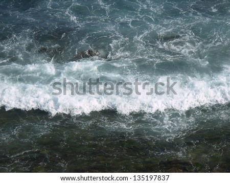splashing waves, breakers shot from above