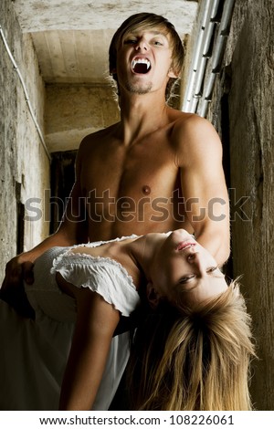 Male vampire is going to bite his female prey. Photo was taken in an old Viennese cellar.