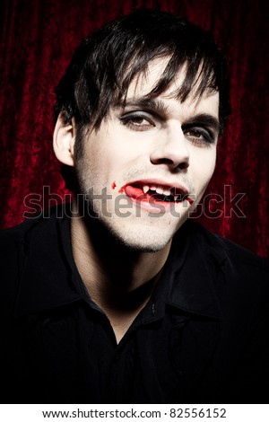 Male vampire licking his bloody lips II