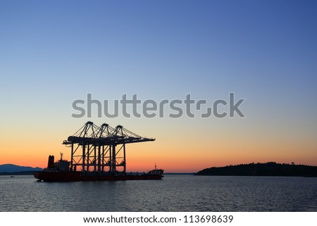 Oil rig ship in the ocean during sunset