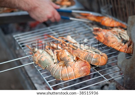 Image of lobsters being roasted on a grill