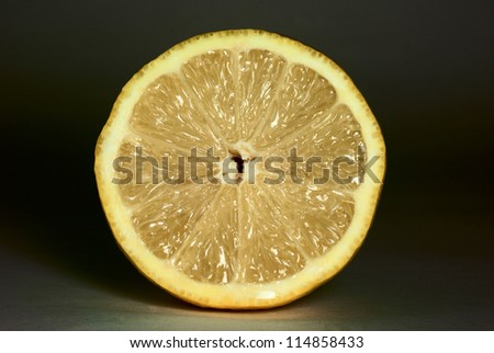 slice of ripe lemon isolated on black