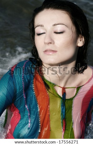 Beautiful woman wet from the sea water