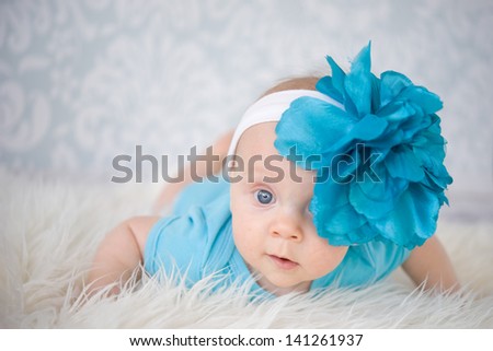 Cute Baby Girl with big flower headband
