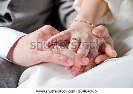 hands and rings of just married couple