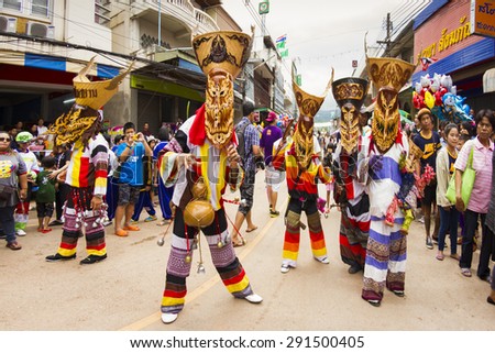 LOEI PROVINCE,THAILAND-JUNE 27:Unidentified men wear ghost costumes at Ghost Festival (Phi Ta Khon - a masked procession celebrated) at Dan Sai district in Loei Province on June 27, 2015.