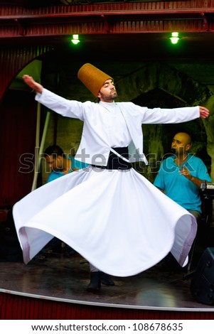Istanbul - July 25: Sufi Whirling Dervish (Semazen) Dances At Sultanahmet During Month Of Ramadan On July 25, 2012 In Istanbul. Semazen Conveys God\'S Spiritual Gift To Those Are Witnessing The Ritual.