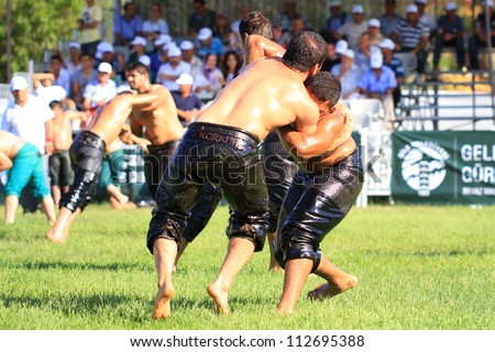 ISTANBUL - AUGUST 24: Unidentified wrestlers in the 8th Sile Annual Oil Wrestling Event on August 24, 2012 in Istanbul. Wrestlers trying to grab each other