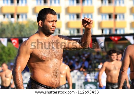 ISTANBUL - AUGUST 24: Unidentified wrestlers in the 8th Sile Annual Oil Wrestling Event on August 24, 2012 in Istanbul. Wrestlers getting ready before the fight.