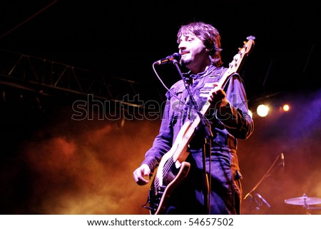 ISTANBUL - MAY 14: Band Mor ve Otesi performs live at Maltepe open air stage on May 14, 2010 in Istanbul, Turkey. Bass Burak Guven of the rock group plays.
