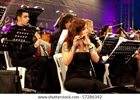 ISTANBUL - JULY 11: Members of the Maltepe Symphonic Orchestra perform live at Maltepe open air stage on July 11, 2010 in Istanbul