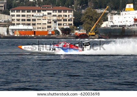 ISTANBUL - SEPTEMBER 25: Off-Shore racing boat speeds along water at World Offshore Championship, September 25, 2010 in Istanbul. The winners Saruhan TAN and Kerim ZORLU drive for the YKM Sport team