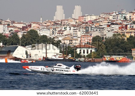 ISTANBUL - SEPTEMBER 25: An Off-Shore racing boat speeds along the water at the UIM World Offshore 225 Championship, September 25, 2010 on the Golden-Horn bay in Istanbul. The BESIKTAS team runs