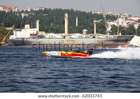 ISTANBUL - SEPTEMBER 25: An Off-Shore racing boat speeds along the water at World Offshore Championship, September 25, 2010 in Istanbul. Berna and Josef MUHLBAUER drive for the GALATASARAY team.