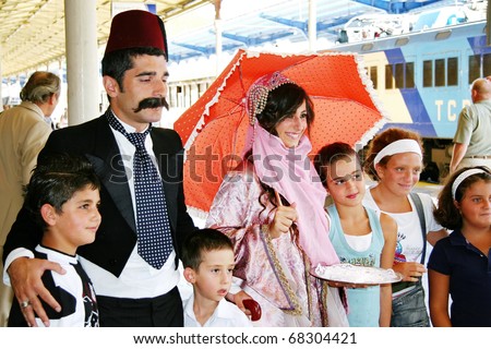 ISTANBUL - SEPTEMBER 02: Orient Express arrives at last stop at 14:30 pm on September 02, 2009 in Istanbul, Turkey. Young couple in Ottoman costume greets the travelers