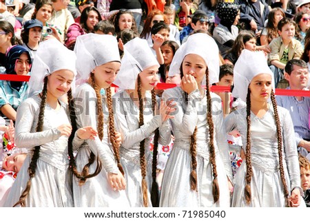 ISTANBUL - APRIL 23: Unidentified 13 years old children in traditional costume perform folk dance on \