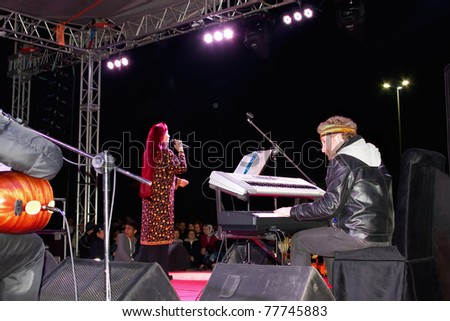 ISTANBUL - MAY 8 : Singer Leman Sam performs live during a concert dedicated to the International Women\'s Day at Maltepe open air stage on May 8, 2011 in Istanbul, Turkey.