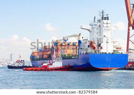 Container ship and tug boats