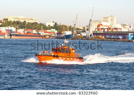 Tug boat in front of sea port