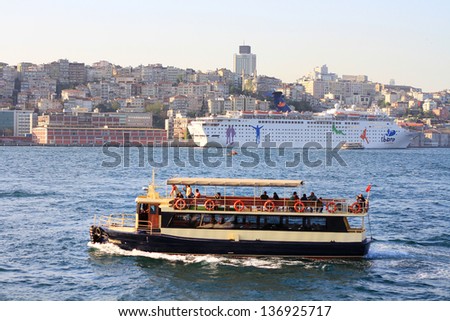 ISTANBUL - APR 29: Pleasure boat sailing into harbor on April 29, 2013 in Istanbul. Sight seeing by boat getting more popular here for tourists. Pleasure boat underway