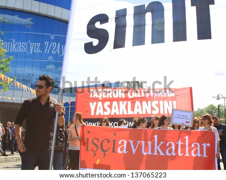 ISTANBUL - MAY 1: Many people can\'t take part in May Day march on May 1, 2013 in Istanbul. Police blocked all the ways to Taksim Square to prevent activists from joining their mates. Lawyers protest