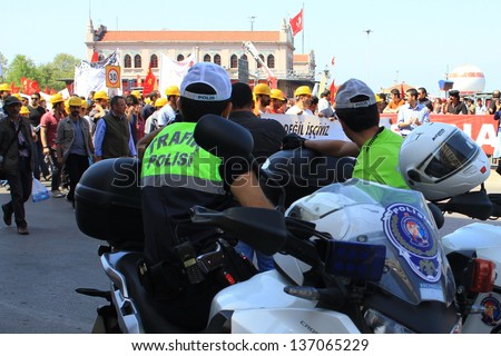 ISTANBUL - MAY 1: Many people can\'t take part in May Day march on May 1, 2013 in Istanbul. Police blocked all the ways to Taksim Square to prevent the activists from joining their mate. Motor officers