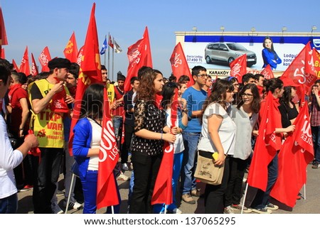 ISTANBUL - MAY 1: Many people can't take part in May Day march on May 1, 2013 in Istanbul. Police blocked all the ways to Taksim Square to prevent the activists from joining their mates. Demonstrators